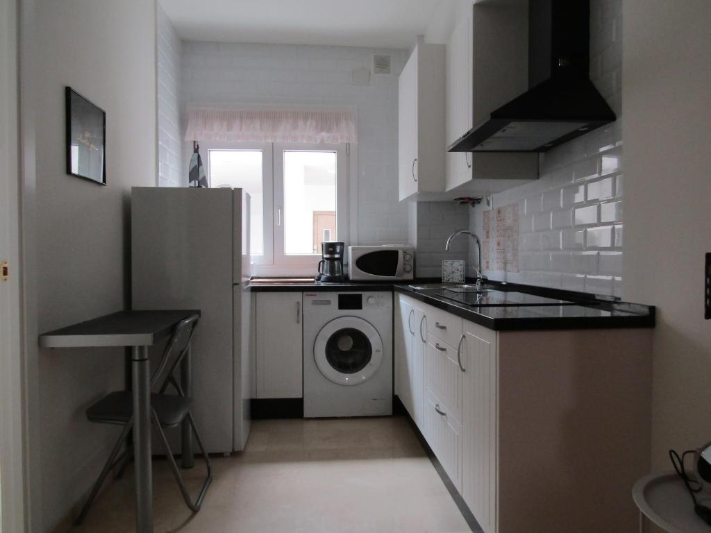 Kuchyň nebo kuchyňský kout v ubytování Apartamento AGP Centro Histórico