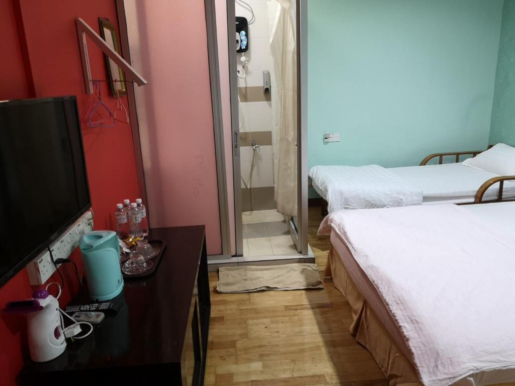 Postel nebo postele na pokoji v ubytování Home Inn Hotel