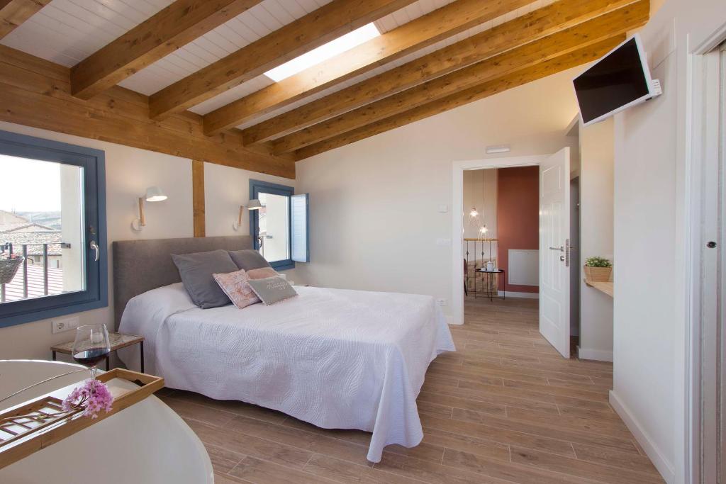 A bed or beds in a room at El Mirador de Eloísa