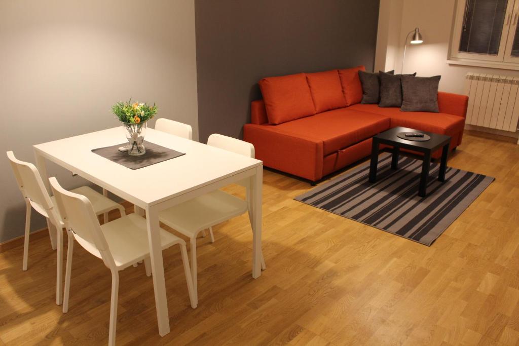 a living room with a table and a couch at Skopje home 3 in Skopje