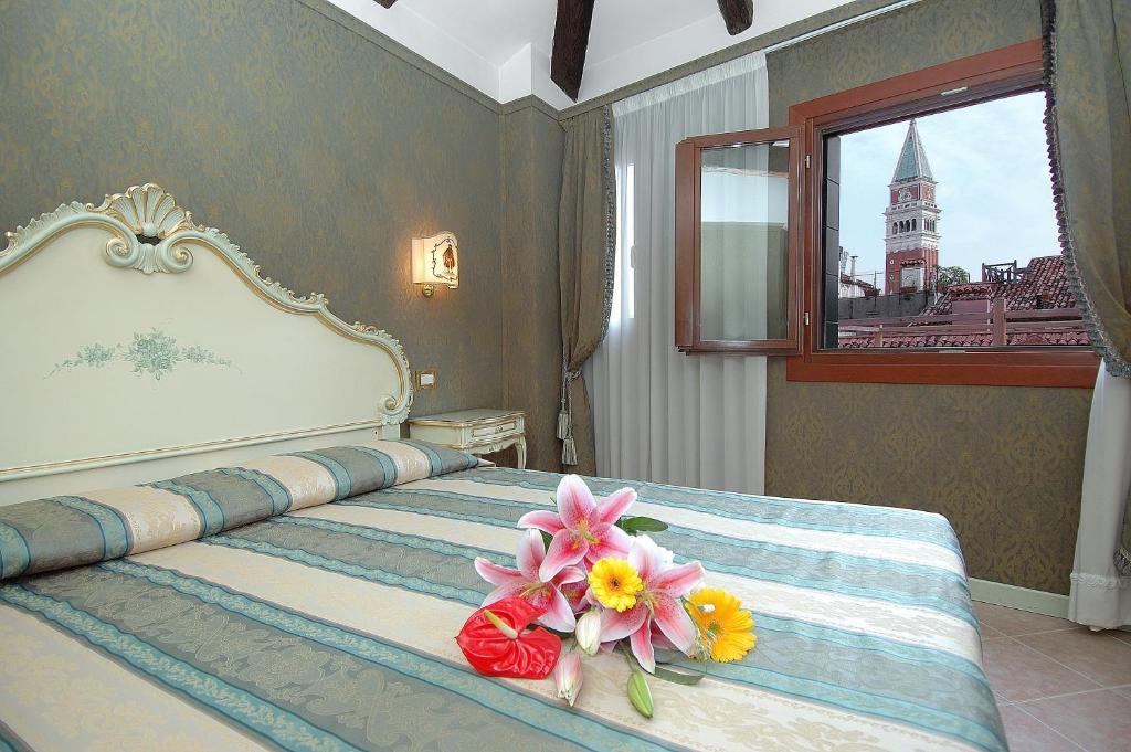 Postel nebo postele na pokoji v ubytování Antica Locanda al Gambero