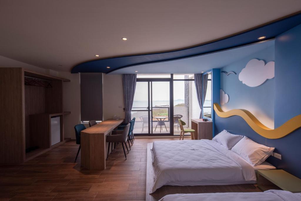 Postel nebo postele na pokoji v ubytování Finding Sea B&B Hall 2