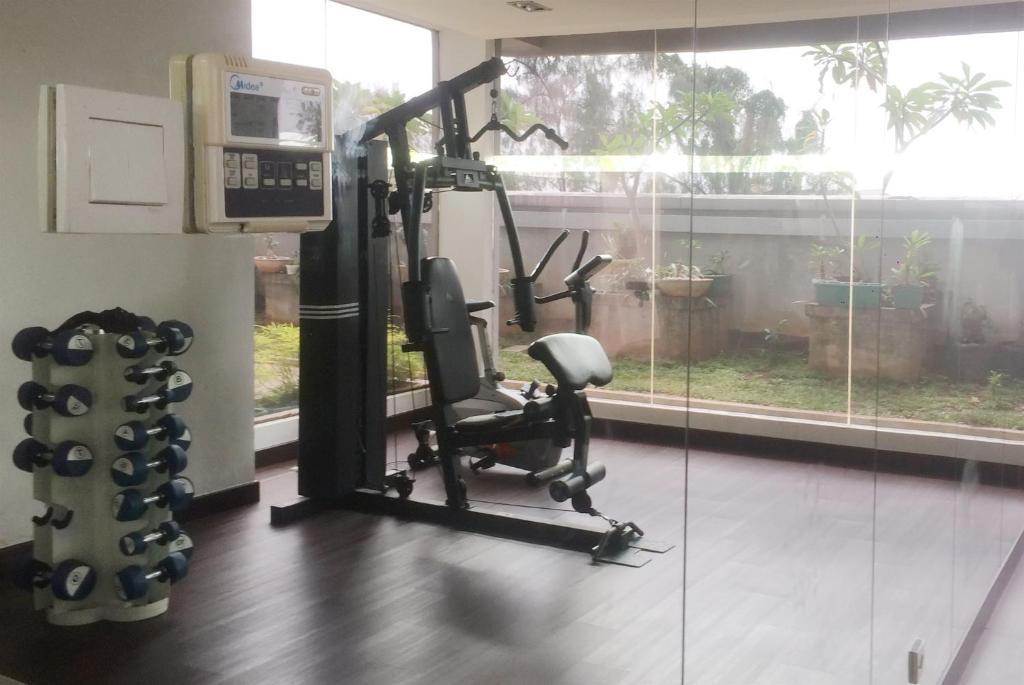 a room with a gym with a treadmill at Spacious 2BR GP Plaza Apartment By Travelio in Jakarta