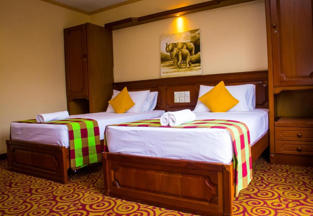 Postel nebo postele na pokoji v ubytování Hotel Lakefield