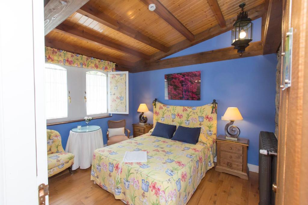 Postel nebo postele na pokoji v ubytování Hotel Rural Casa Xusto