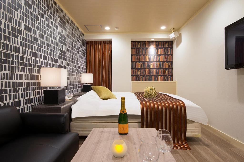 Postel nebo postele na pokoji v ubytování HOTEL U's 香櫨園
