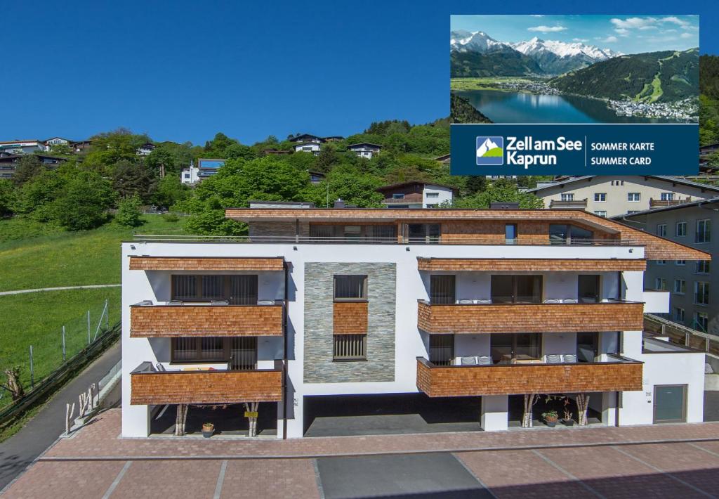 a rendering of a building with mountains in the background at Appartement Living Schönwies in Zell am See