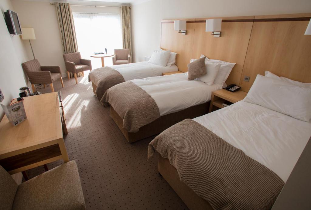 Postel nebo postele na pokoji v ubytování Hotel Minella & Leisure Centre
