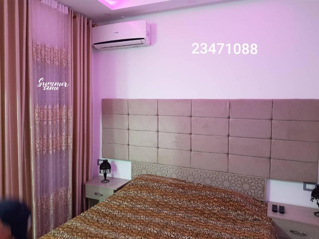 Postel nebo postele na pokoji v ubytování APPARTEMENT "DINA" Kélibia