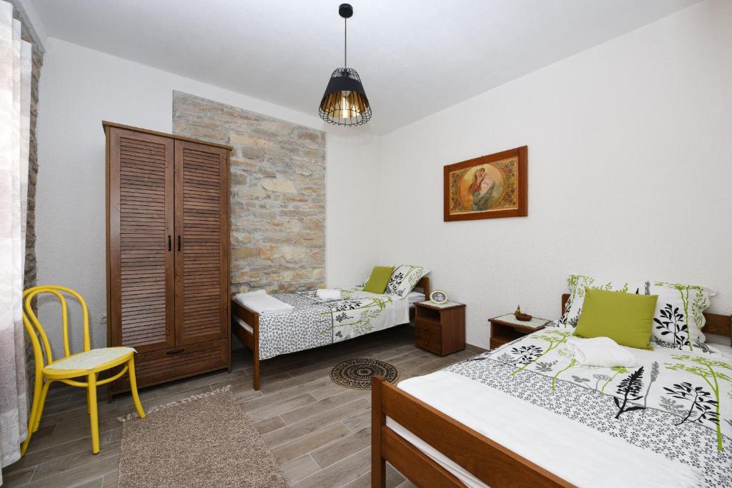 Postel nebo postele na pokoji v ubytování Villa Granar ZadarVillas
