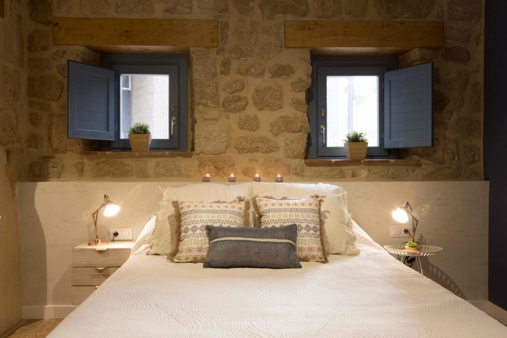 A bed or beds in a room at El Mirador de Eloísa
