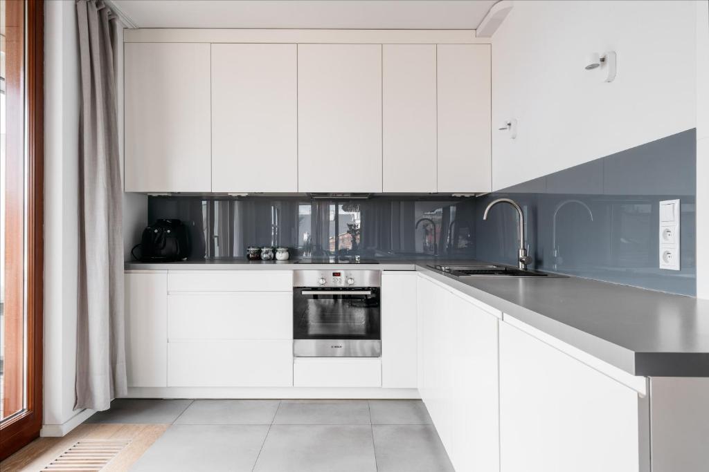 Kuchyňa alebo kuchynka v ubytovaní Penthouse Uptown - LoftAffair