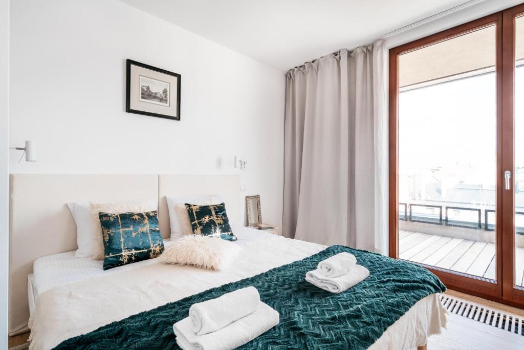 Posteľ alebo postele v izbe v ubytovaní Penthouse Uptown - LoftAffair