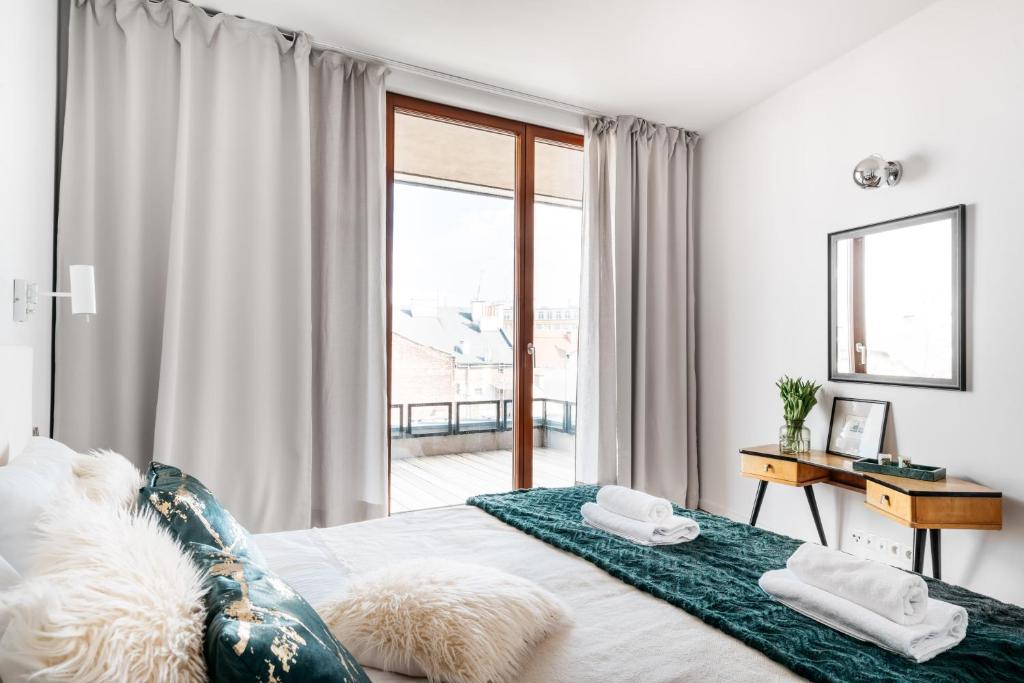 Posteľ alebo postele v izbe v ubytovaní Penthouse Uptown - LoftAffair