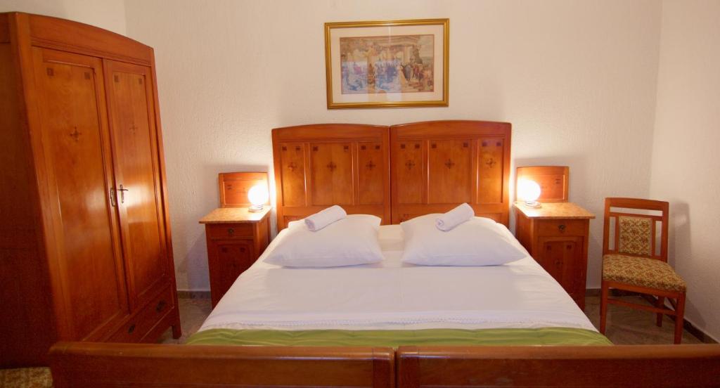 Posteľ alebo postele v izbe v ubytovaní Apartmani Loreta