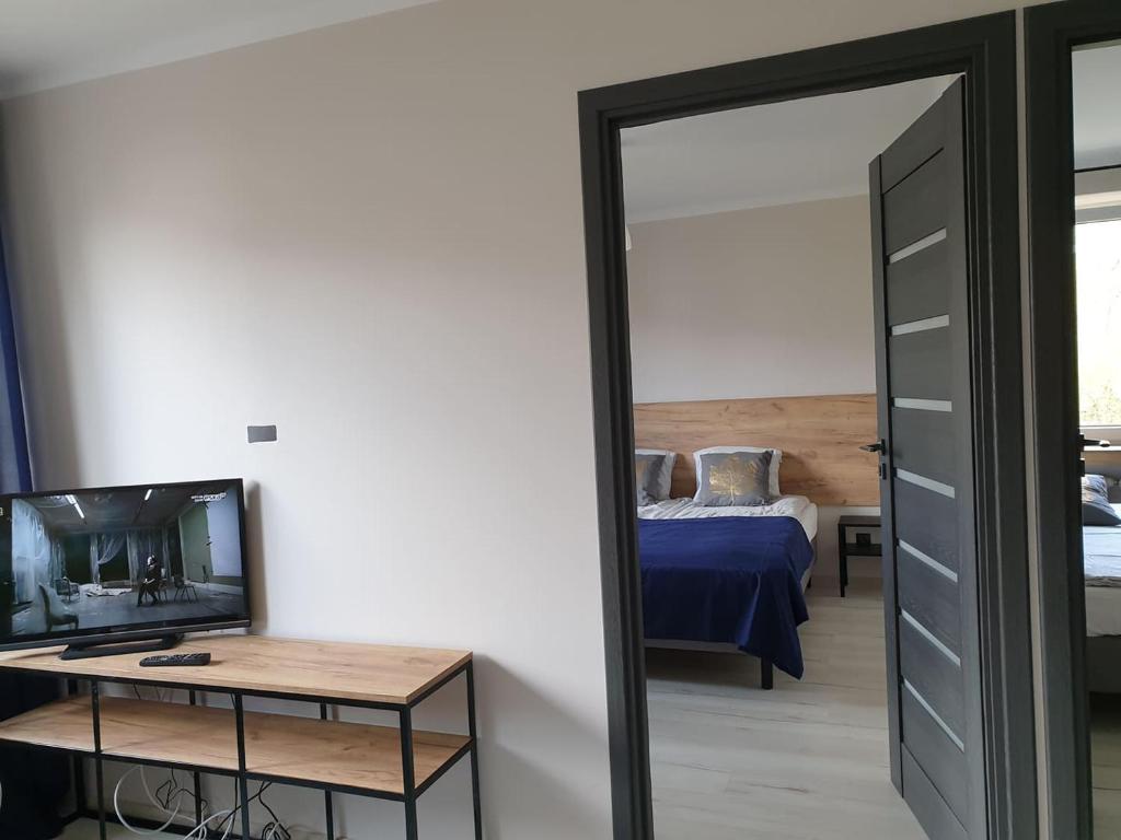Posteľ alebo postele v izbe v ubytovaní VISTULA two-bedroom Apartment