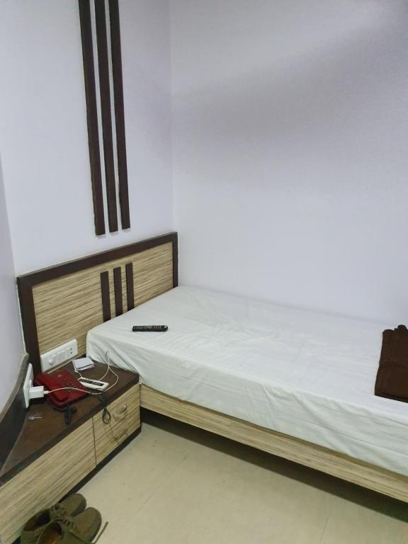 Postel nebo postele na pokoji v ubytování Hotel Apex