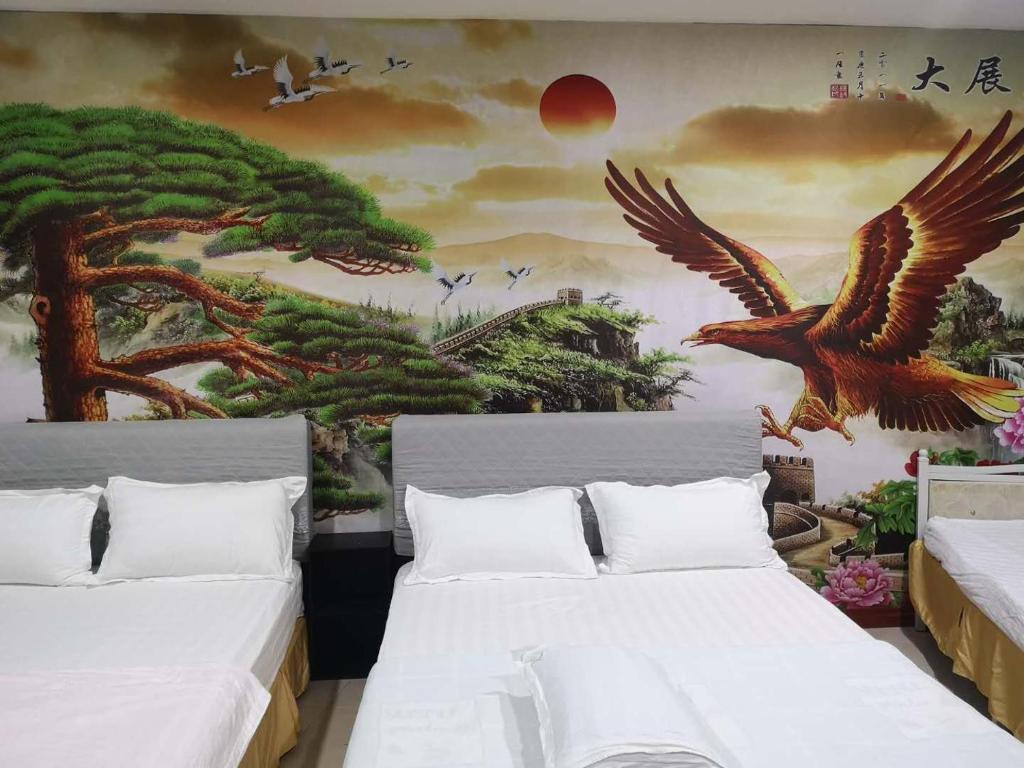 Postel nebo postele na pokoji v ubytování Home Inn Hotel