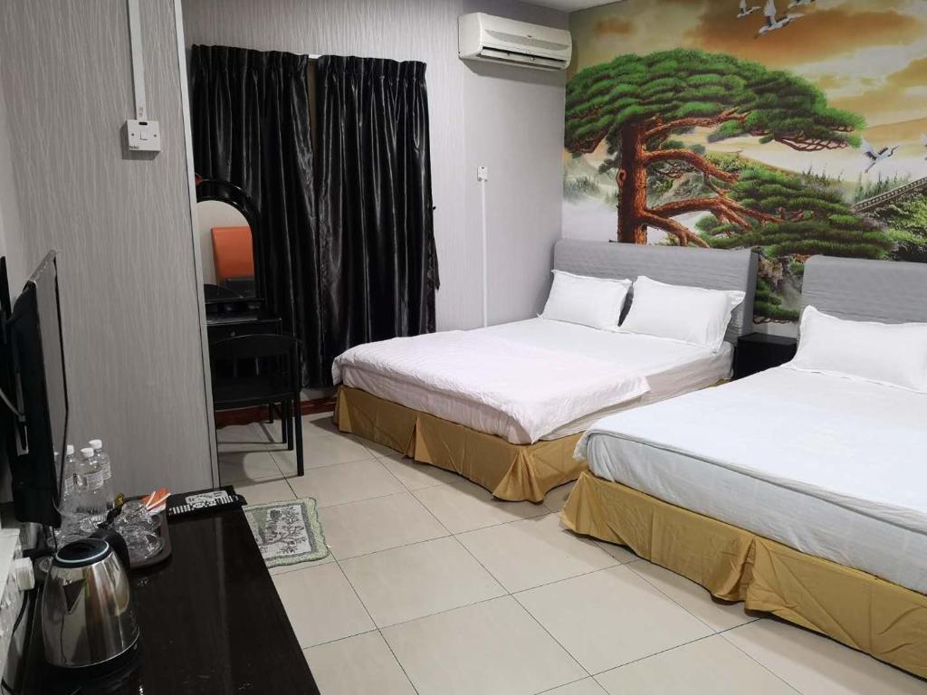 Postel nebo postele na pokoji v ubytování Home Inn Hotel