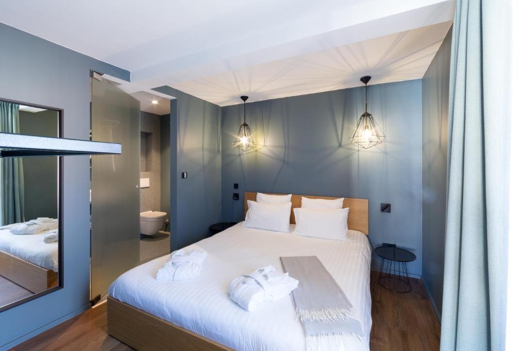 Postel nebo postele na pokoji v ubytování Hostellerie du Grünewald