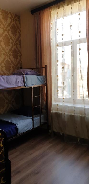 Postel nebo postele na pokoji v ubytování Guest House Didis