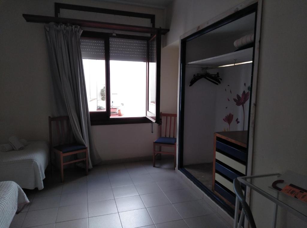 Postel nebo postele na pokoji v ubytování Hotel Corisco