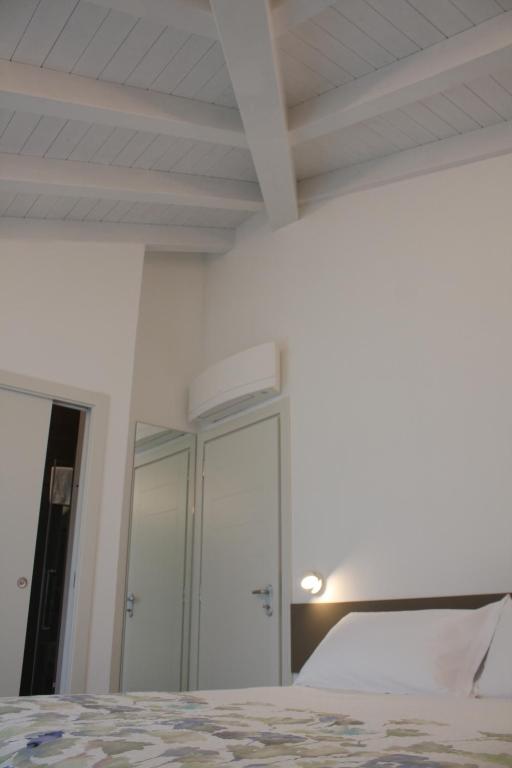 Postel nebo postele na pokoji v ubytování ARIA Design B&B Levanto