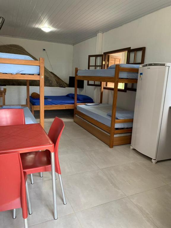 Postel nebo postele na pokoji v ubytování Flats Alto das Pedras