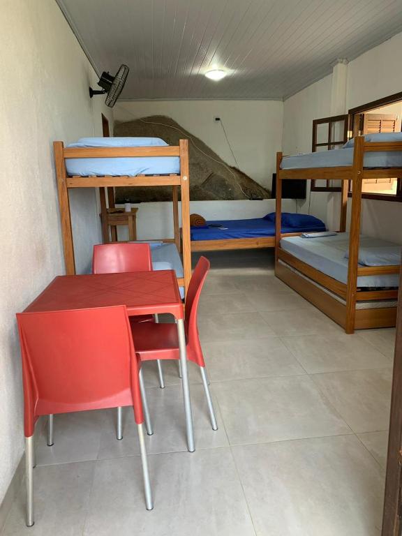Postel nebo postele na pokoji v ubytování Flats Alto das Pedras