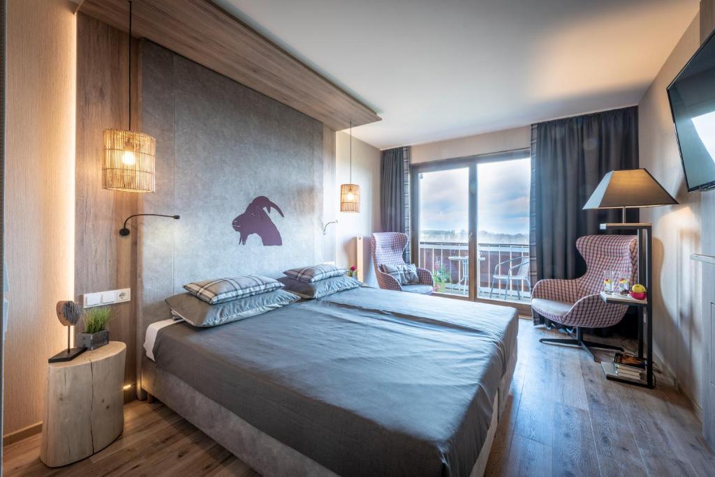 Postel nebo postele na pokoji v ubytování Berggasthof & Hotel Sennhütte