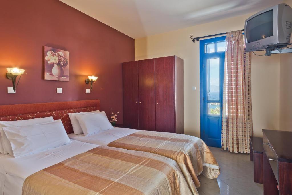 Postel nebo postele na pokoji v ubytování Alkioni Hotel