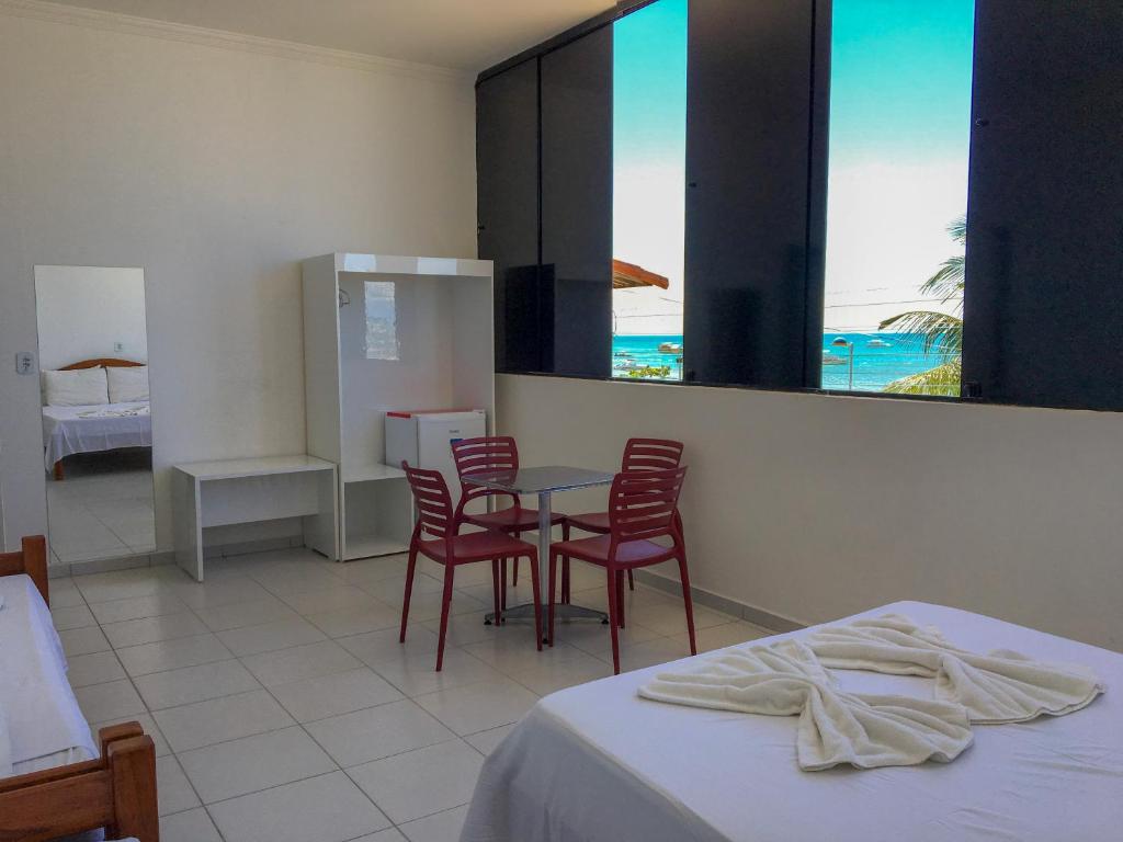Postel nebo postele na pokoji v ubytování Maraga Beach Hostel