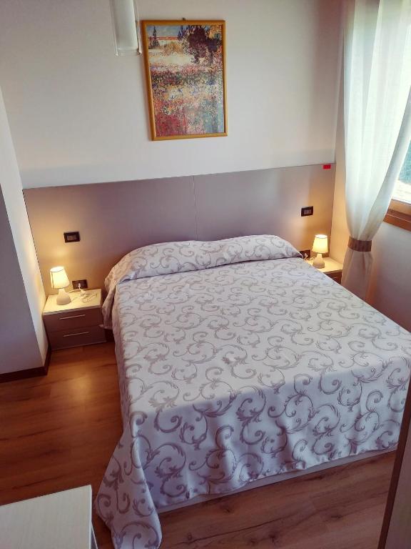 A bed or beds in a room at Agriturismo le Colonie