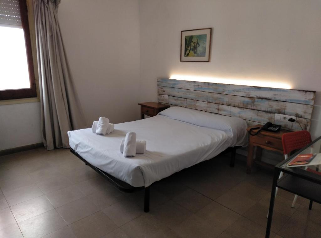 Postel nebo postele na pokoji v ubytování Hotel Corisco