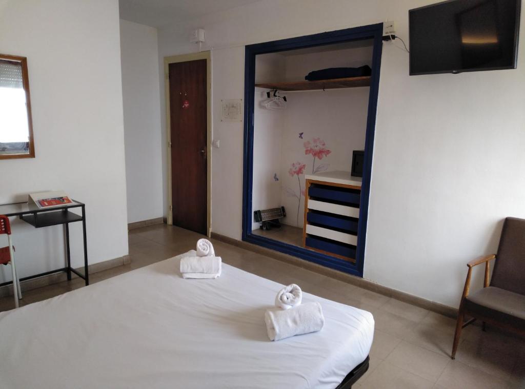 Postel nebo postele na pokoji v ubytování Hotel Corisco