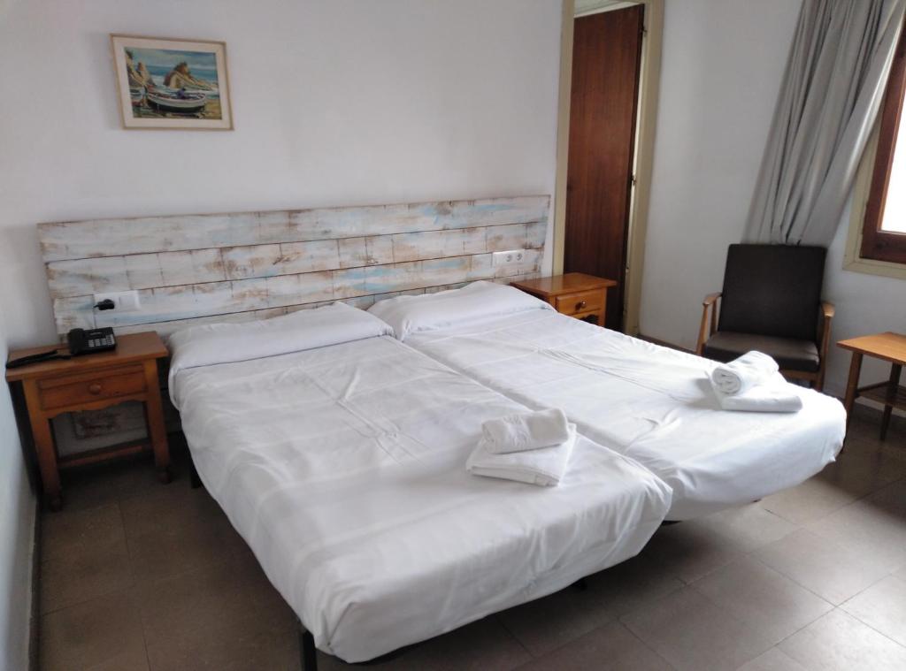 Postel nebo postele na pokoji v ubytování Hotel Corisco
