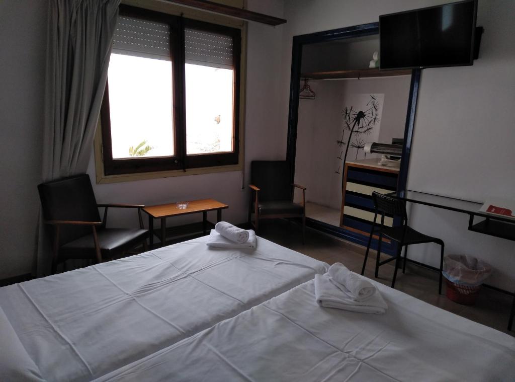 Postel nebo postele na pokoji v ubytování Hotel Corisco
