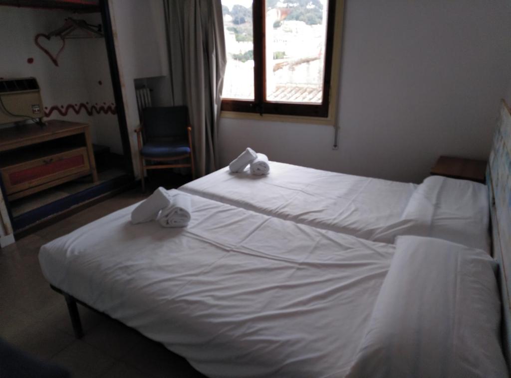 Postel nebo postele na pokoji v ubytování Hotel Corisco