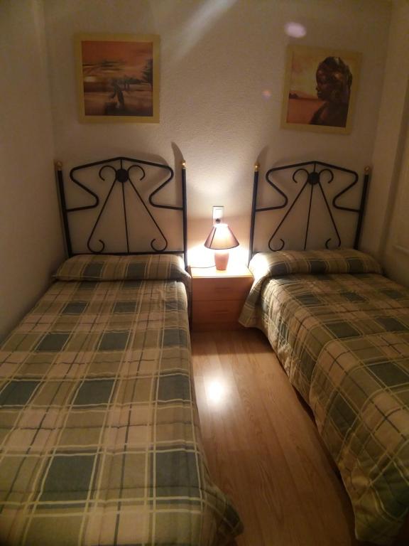 Posteľ alebo postele v izbe v ubytovaní Bonito Apartamento con varias piscinas