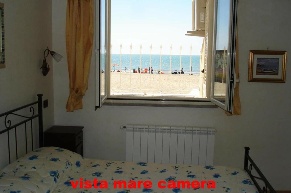 Postel nebo postele na pokoji v ubytování Camere Sul Mare