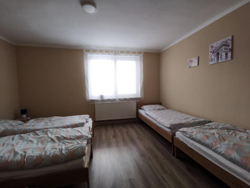 Postel nebo postele na pokoji v ubytování U Vrbů