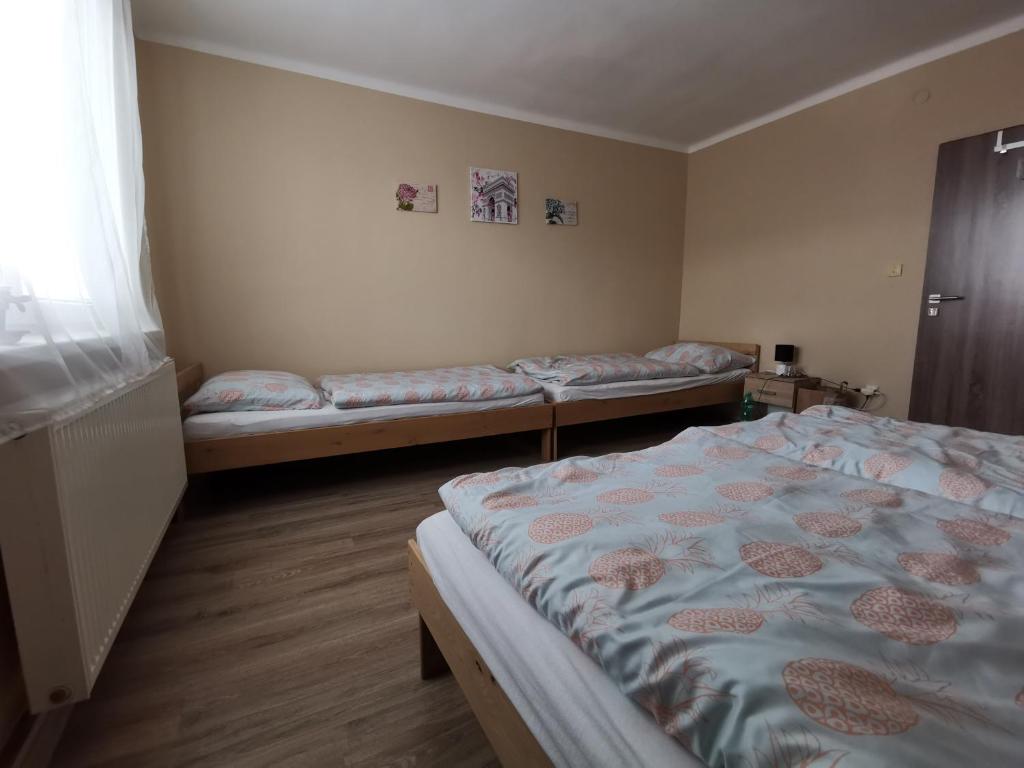 Postel nebo postele na pokoji v ubytování U Vrbů