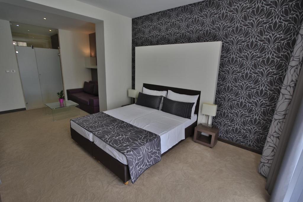 Postel nebo postele na pokoji v ubytování Beach Hotel Split