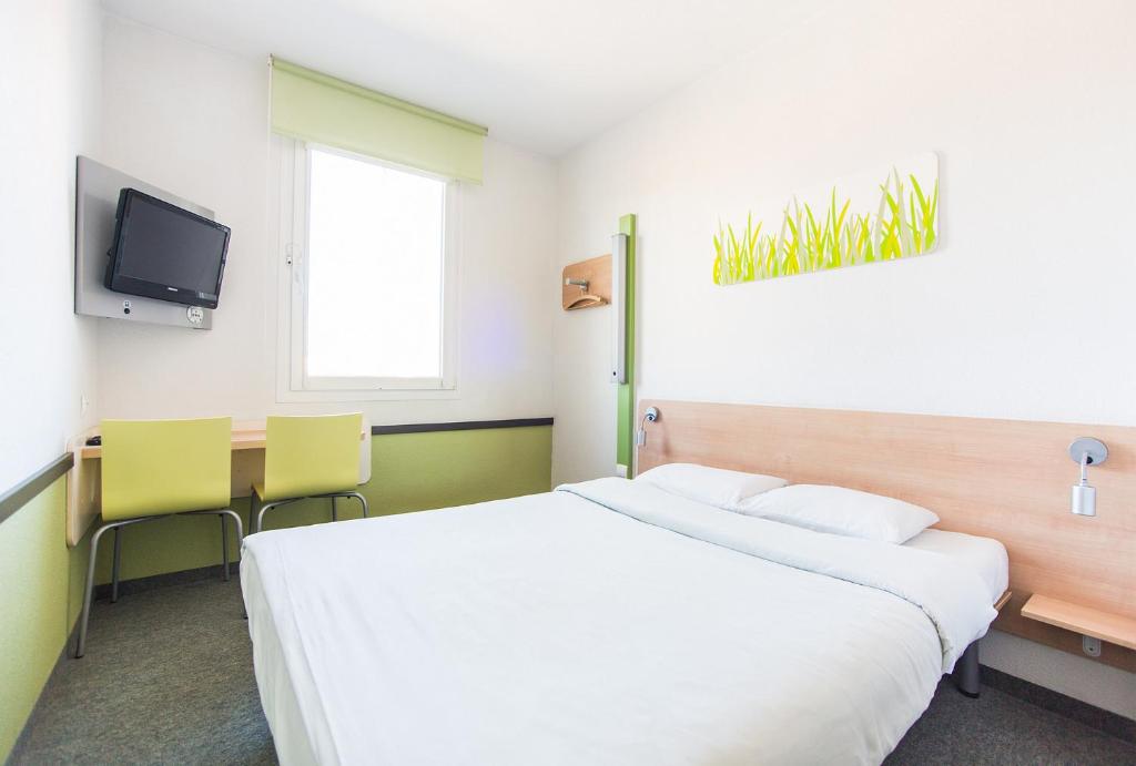 Postel nebo postele na pokoji v ubytování ibis budget Torun