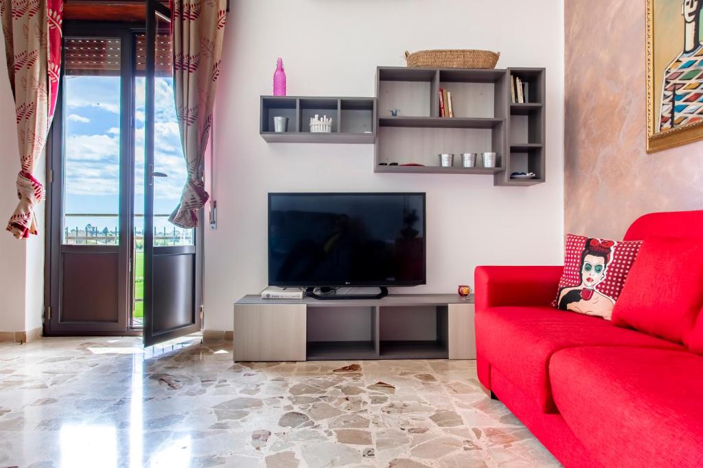 Televízia a/alebo spoločenská miestnosť v ubytovaní Casa Abela New