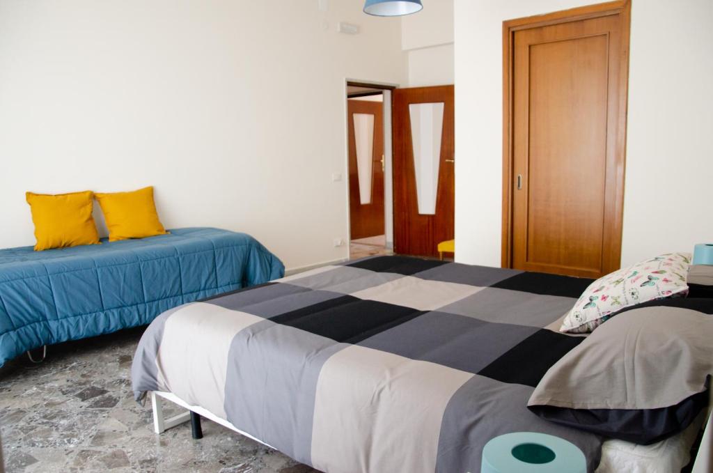 Postel nebo postele na pokoji v ubytování Casa Gentile Carducci