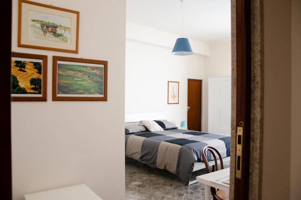 Postel nebo postele na pokoji v ubytování Casa Gentile Carducci