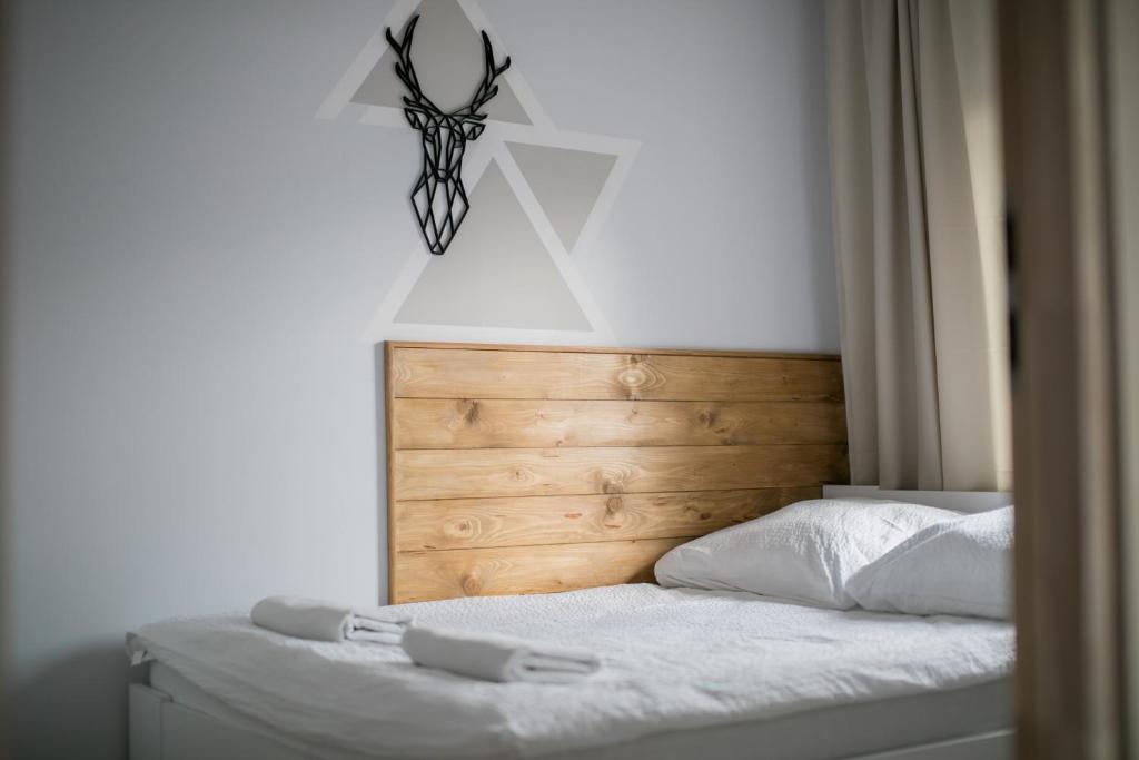 Posteľ alebo postele v izbe v ubytovaní Apartamenty Przylesie