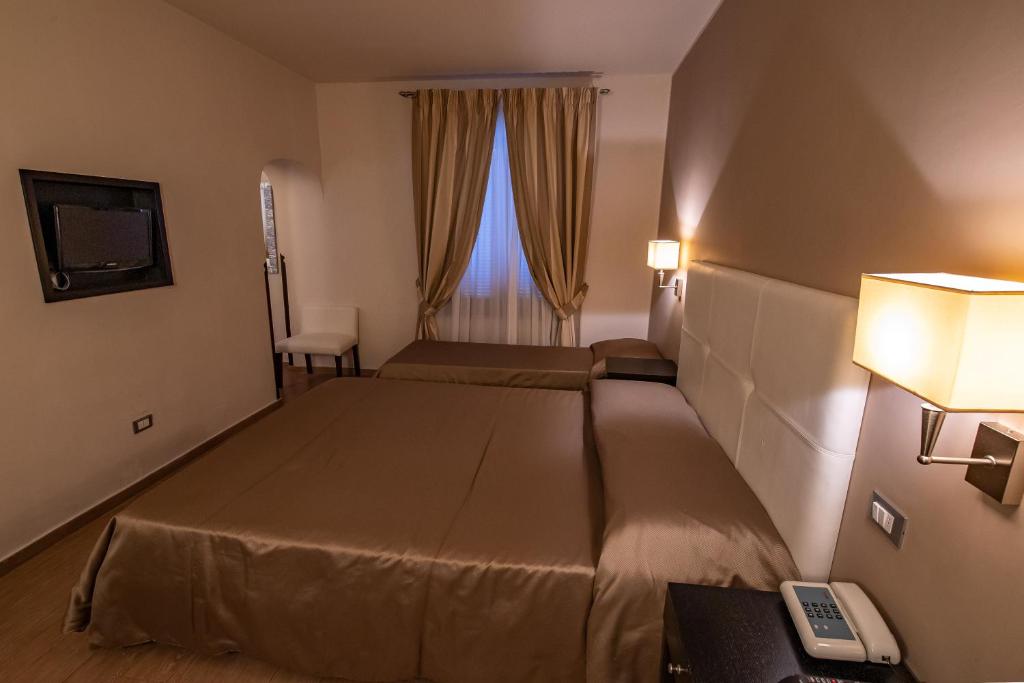 TV a/nebo společenská místnost v ubytování Hotel Moderno