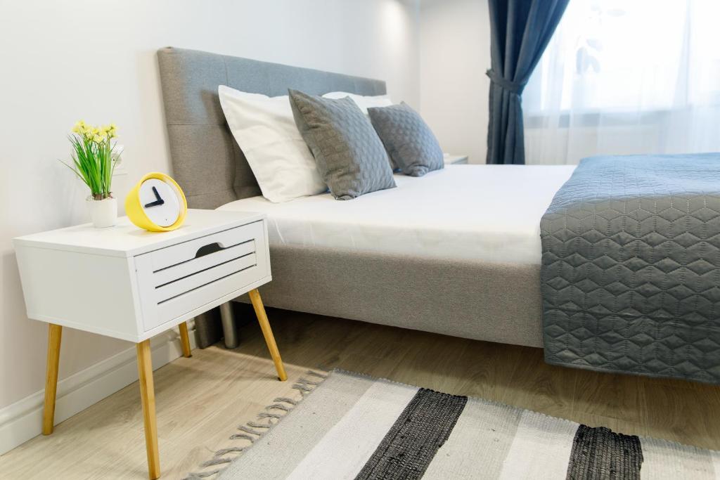 Postel nebo postele na pokoji v ubytování Apart-Hotel "LAVINA"